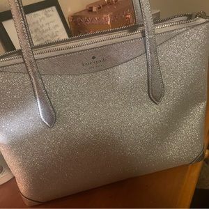Kate Spade shimmy Tote in Lunar Light- which is a glittery silver.